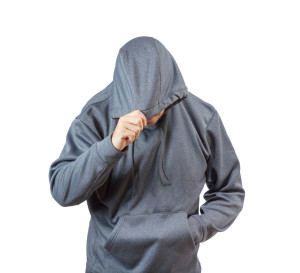 Adult caucasian man in hooded sweatshirt isolated on white background.