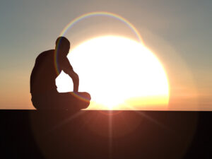 man silhouette against large setting sun 7 16 22